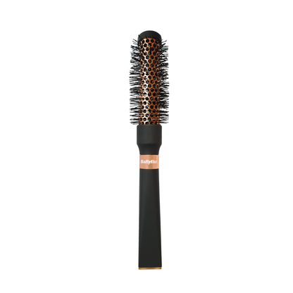 Brosse brushing BaByliss Signature avec cylindre métallique cuivré pour un coiffage rapide et homogène.